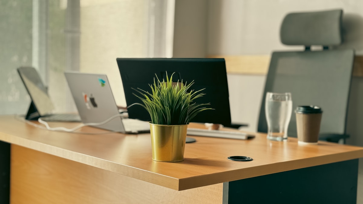 Multi-monitor developer workspace with code on screens